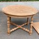 Round extendable farmhouse dining table, stripped, Louis XIII style from the 1960s.
