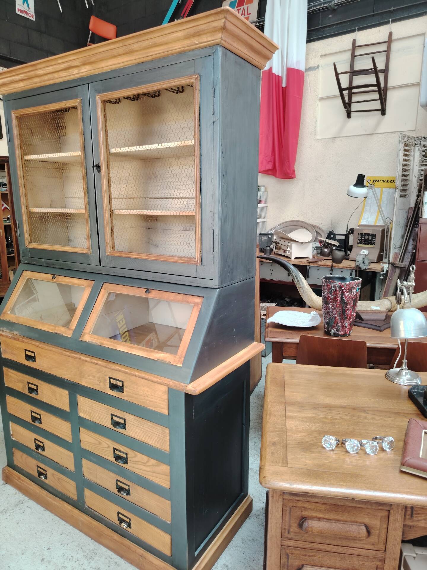 Large two-body grain merchant cabinet made of solid wood.