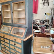 Large two-body grain merchant cabinet made of solid wood.