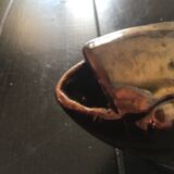 Numbered gold ceramic fish vase, about 1900