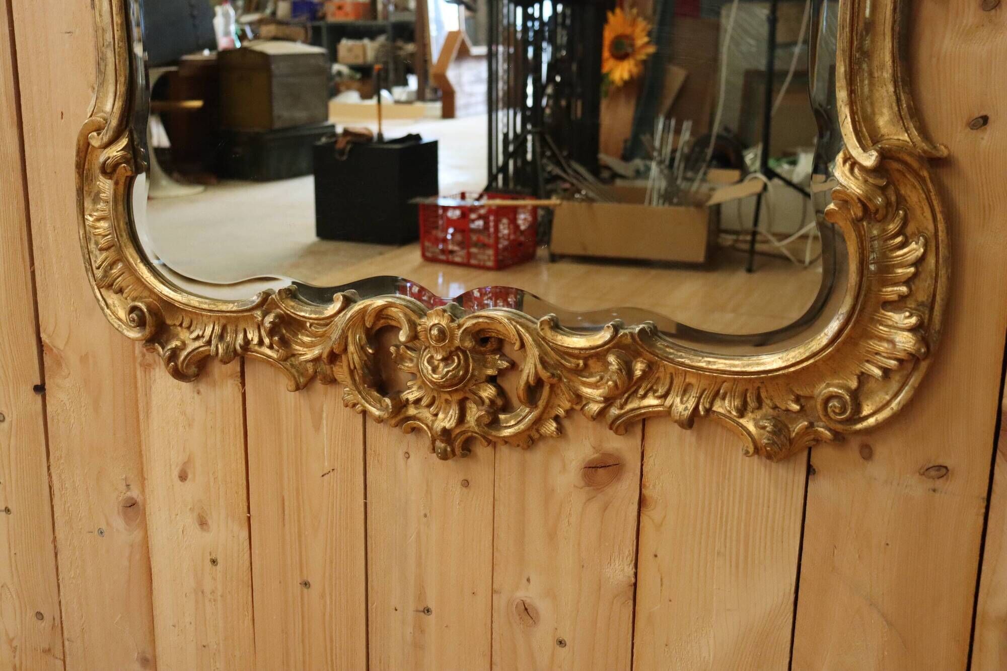 Golden wooden mirror in Louis XV style