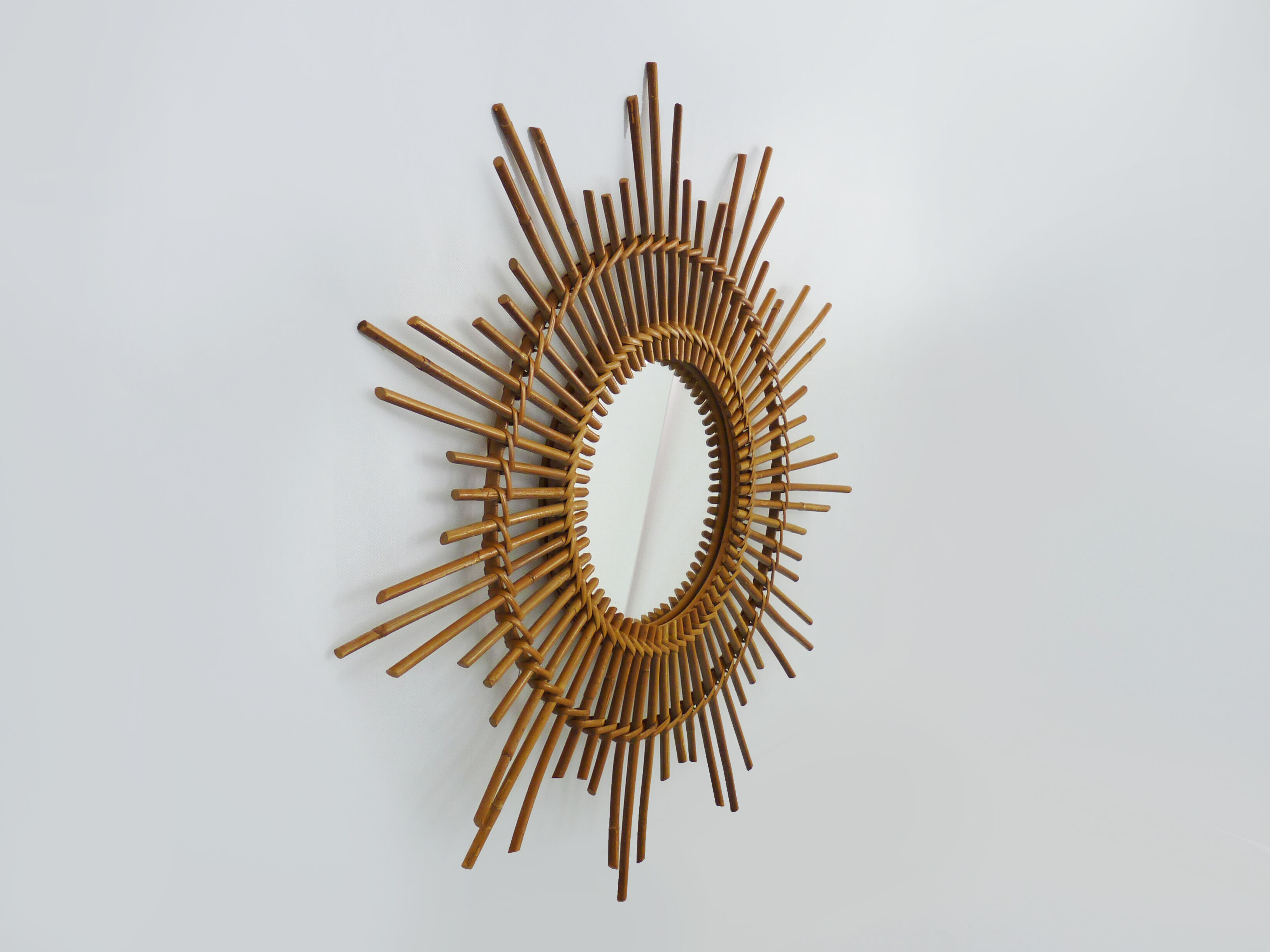 Vintage rattan sun mirror. Year 60