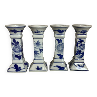 Four candlesticks with blue patterns
