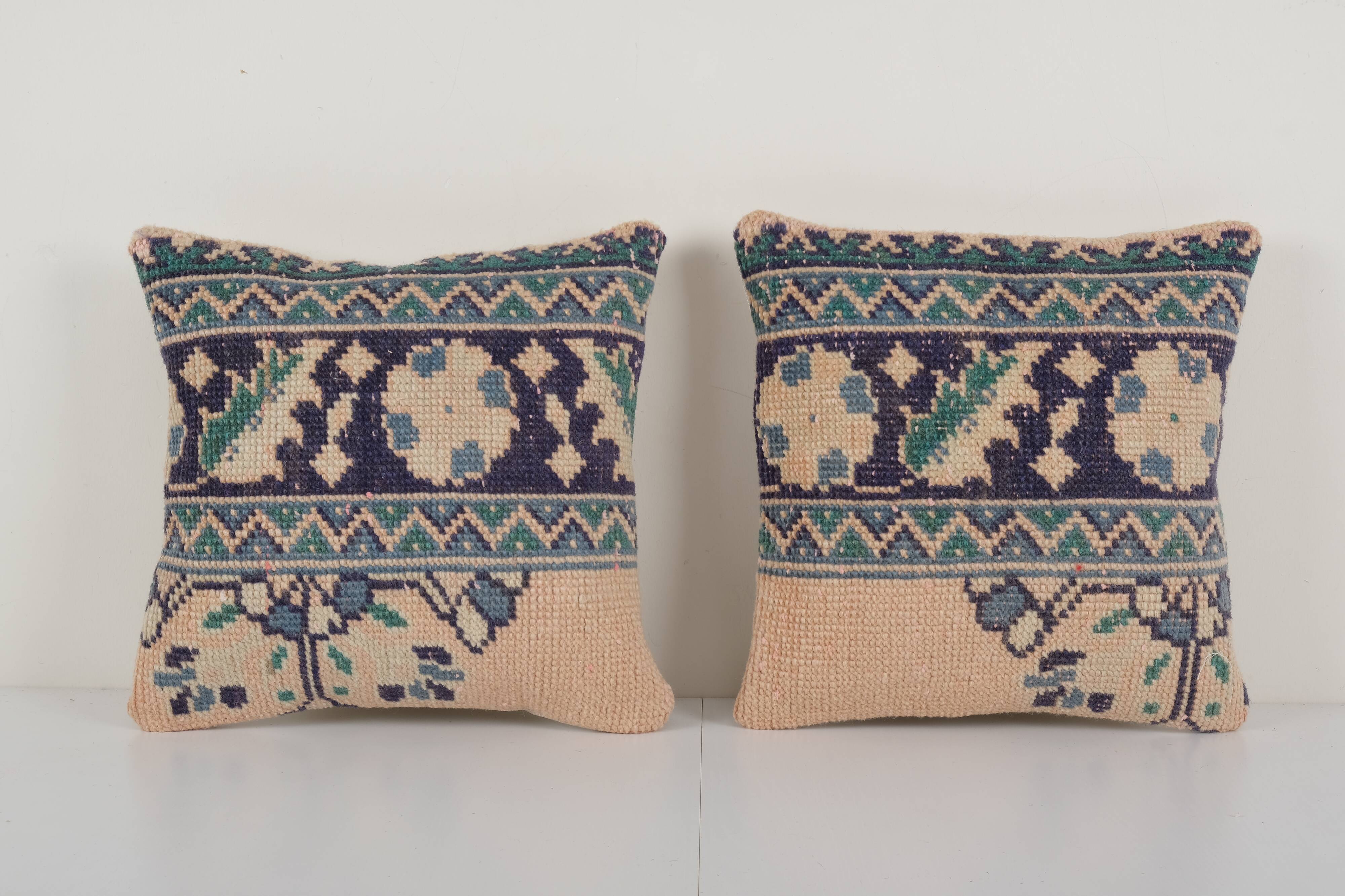 Set of two muted ecru carpet rug pillows