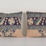 Set of two muted ecru carpet rug pillows