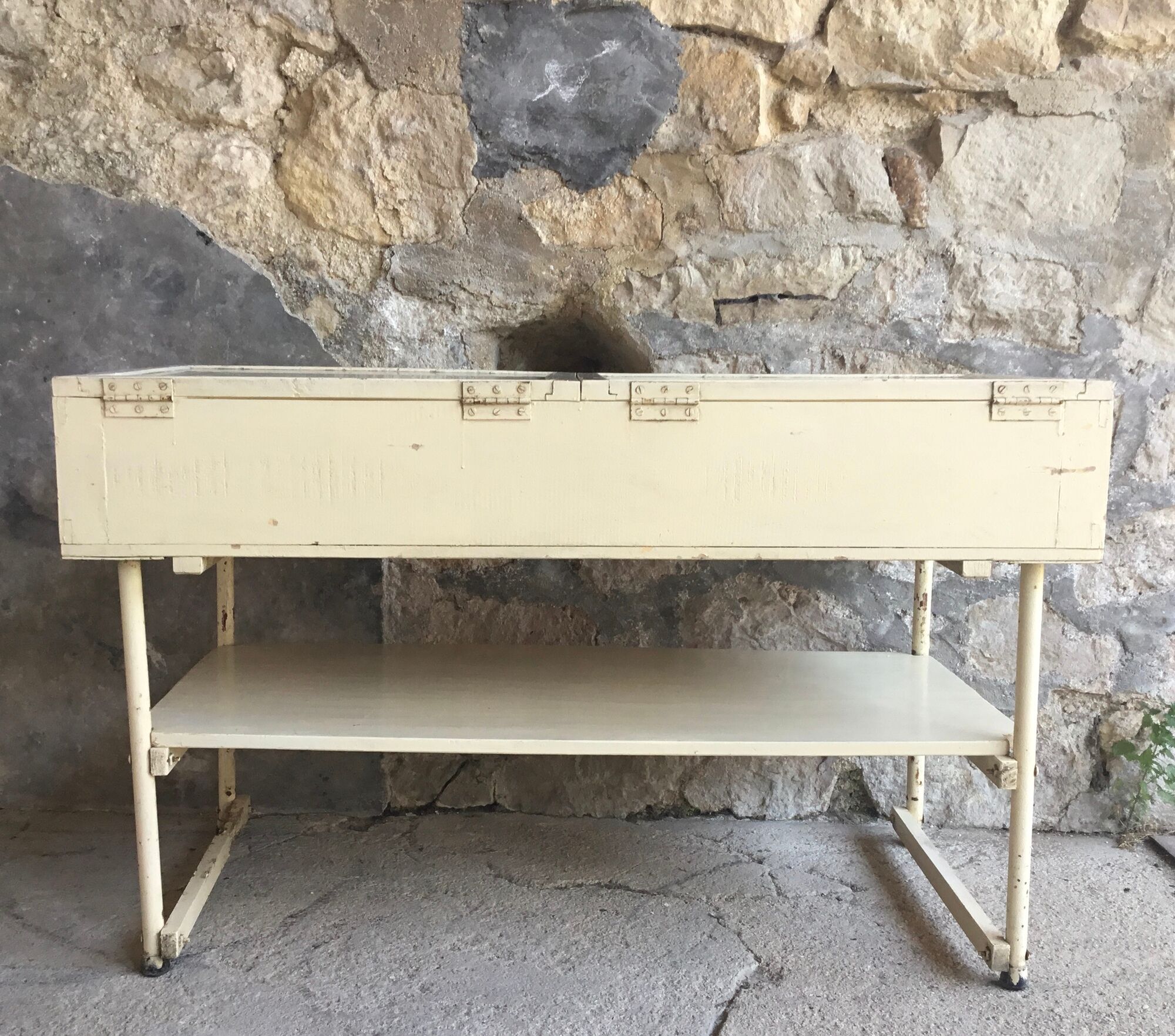 Old showcase on tubular metal feet - early twentieth century