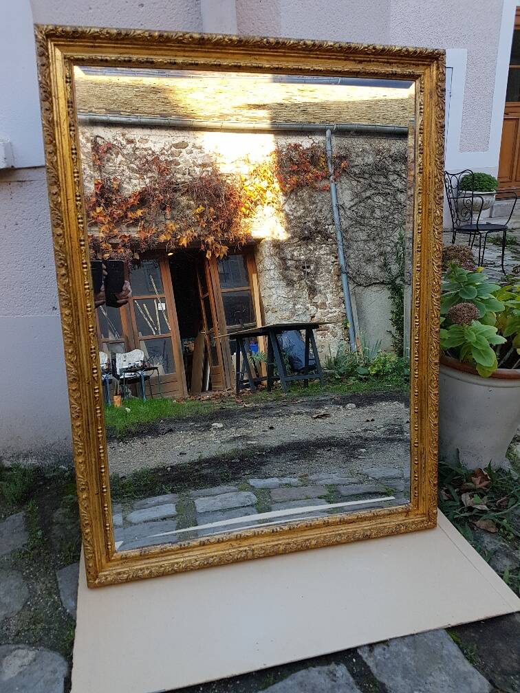 Grand golden mirror in louis xvi style