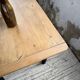 Oak farmhouse table with turned black legs.