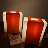 Pair of orange plexiglass wall sconces from the seventies.