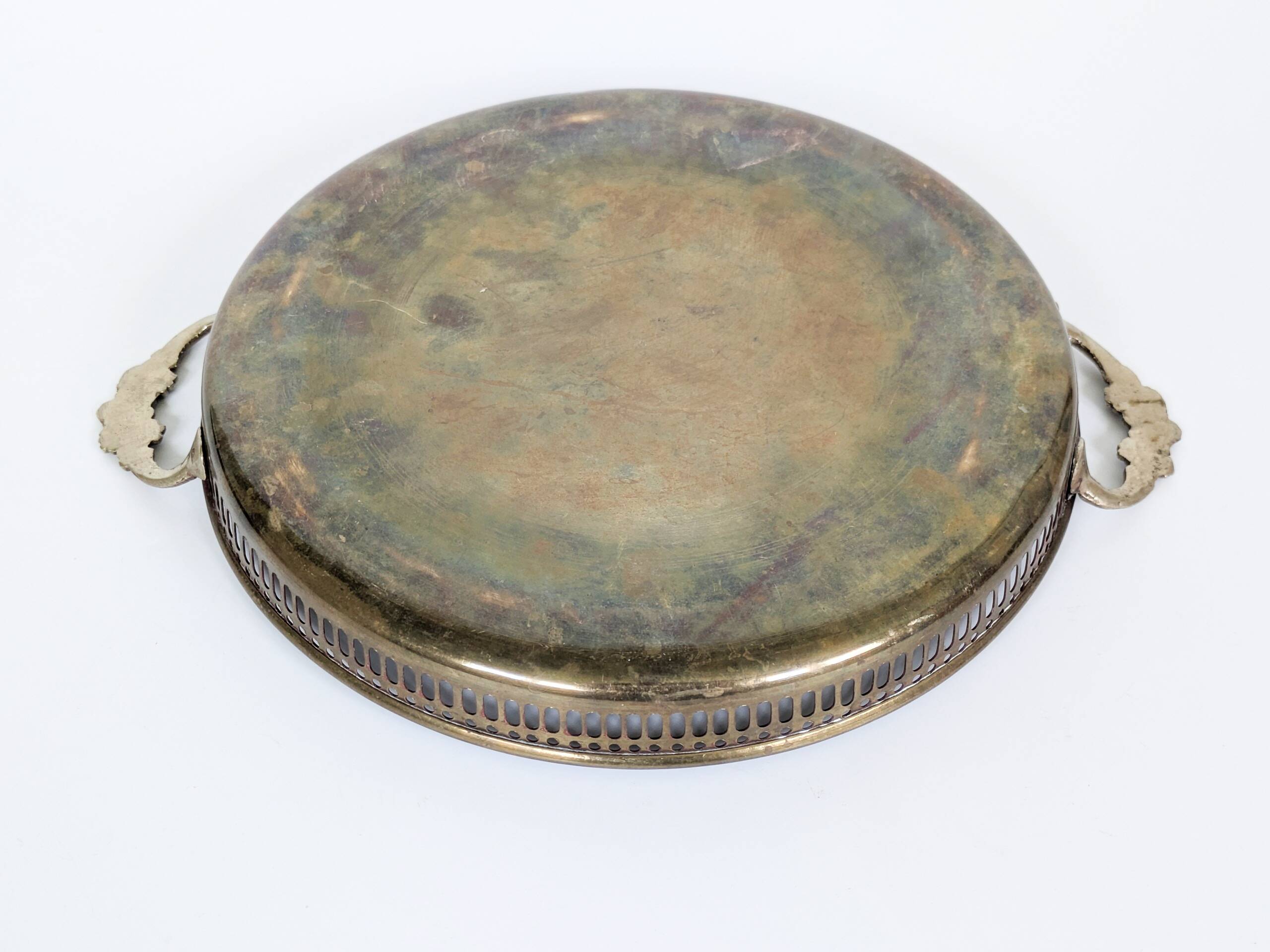 Vintage decorative brass tray, pierced edge and floral handles.