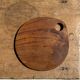 Average circular teak monoxyle chopping board with handle 26 x 18.