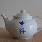 Teapot set and 9 cups with Chinese and French words