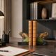 Art Deco pair of bookends with ram's heads, patinated metal and black marble.