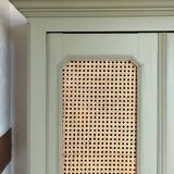 Caned cabinet with oranges