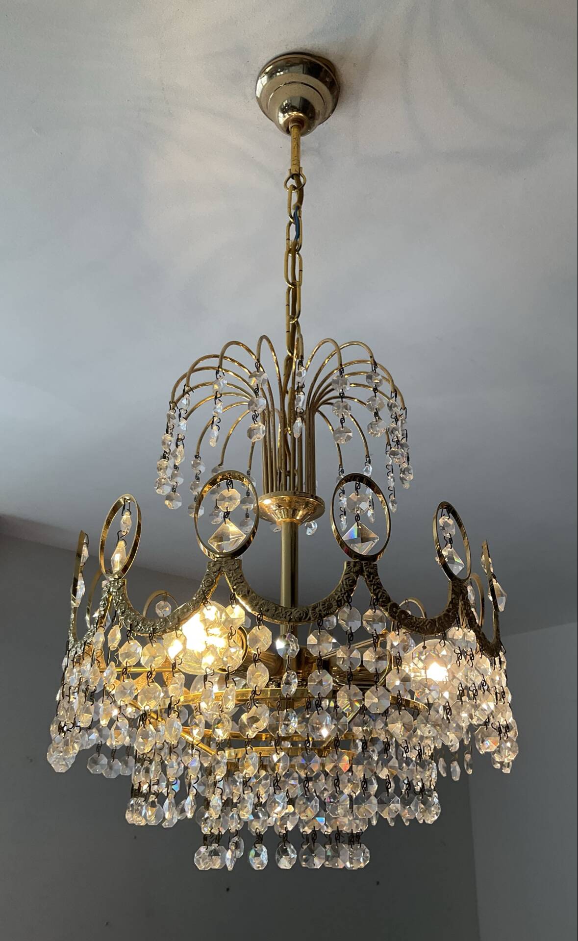 Brass chandelier with crystal pendants from the 1970s.