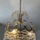 Brass chandelier with crystal pendants from the 1970s.