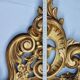 Large oval gold mirror, Louis XV rococo style, late 19th century, 114 x 66 cm.