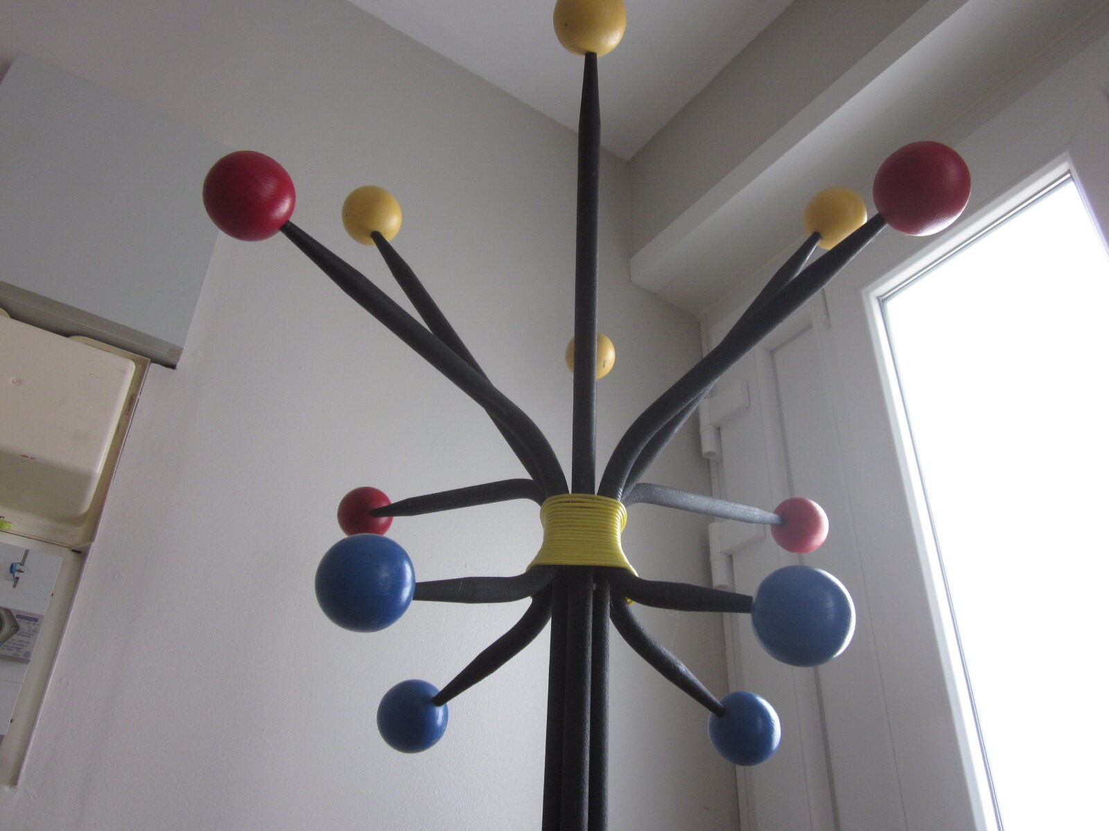 Vintage coat holder has 12 balls