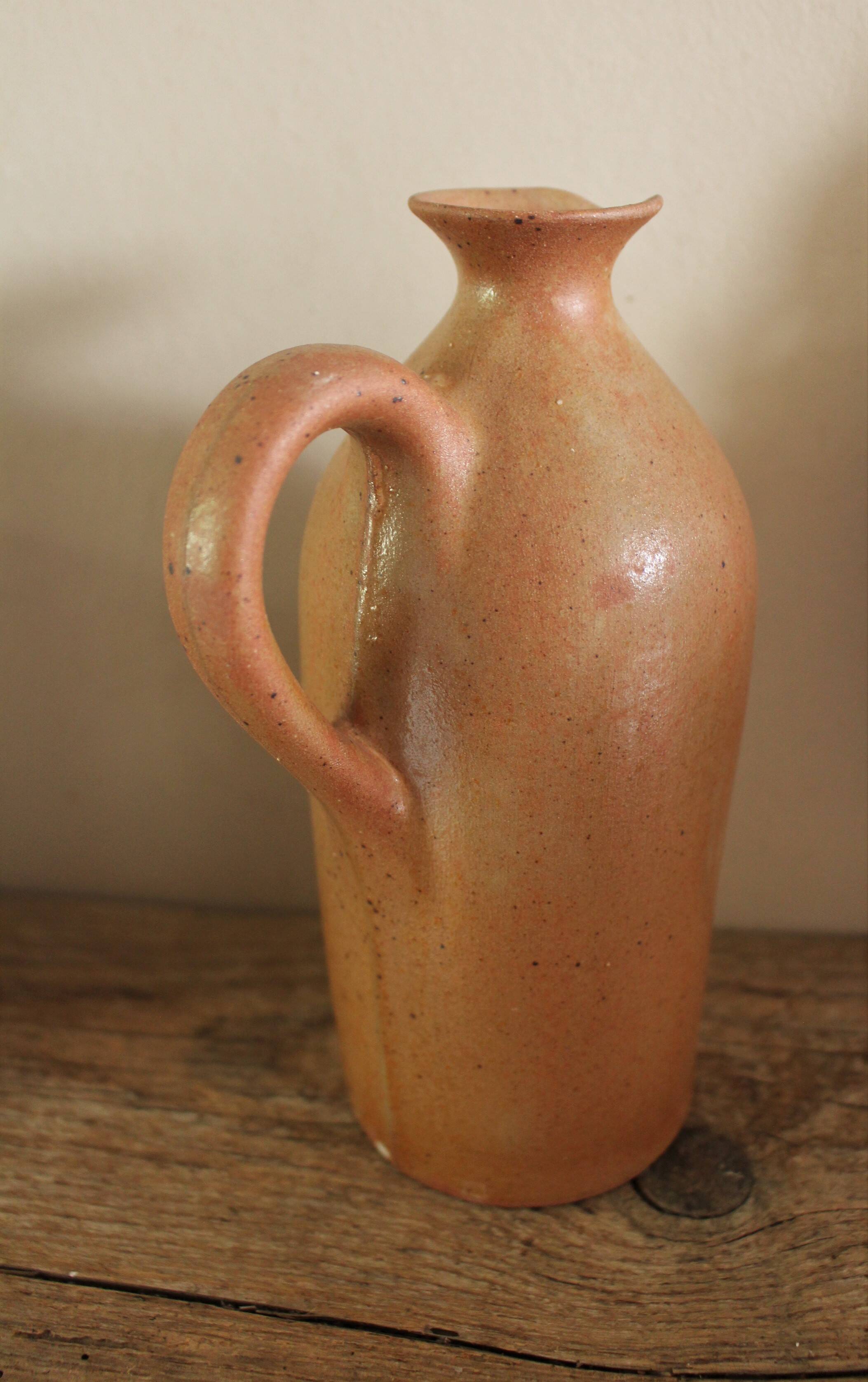 Vintage stoneware liqueur bottle with handle