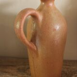 Vintage stoneware liqueur bottle with handle