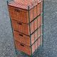 Metal chest of drawers and four woven wicker baskets