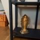 Small vintage shelf reimagined in midnight blue & gold, curiosity cabinet.