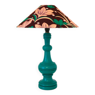 Old lamp with green turned wooden base and printed conical lampshade