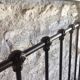 old bed with vintage painted metal bars