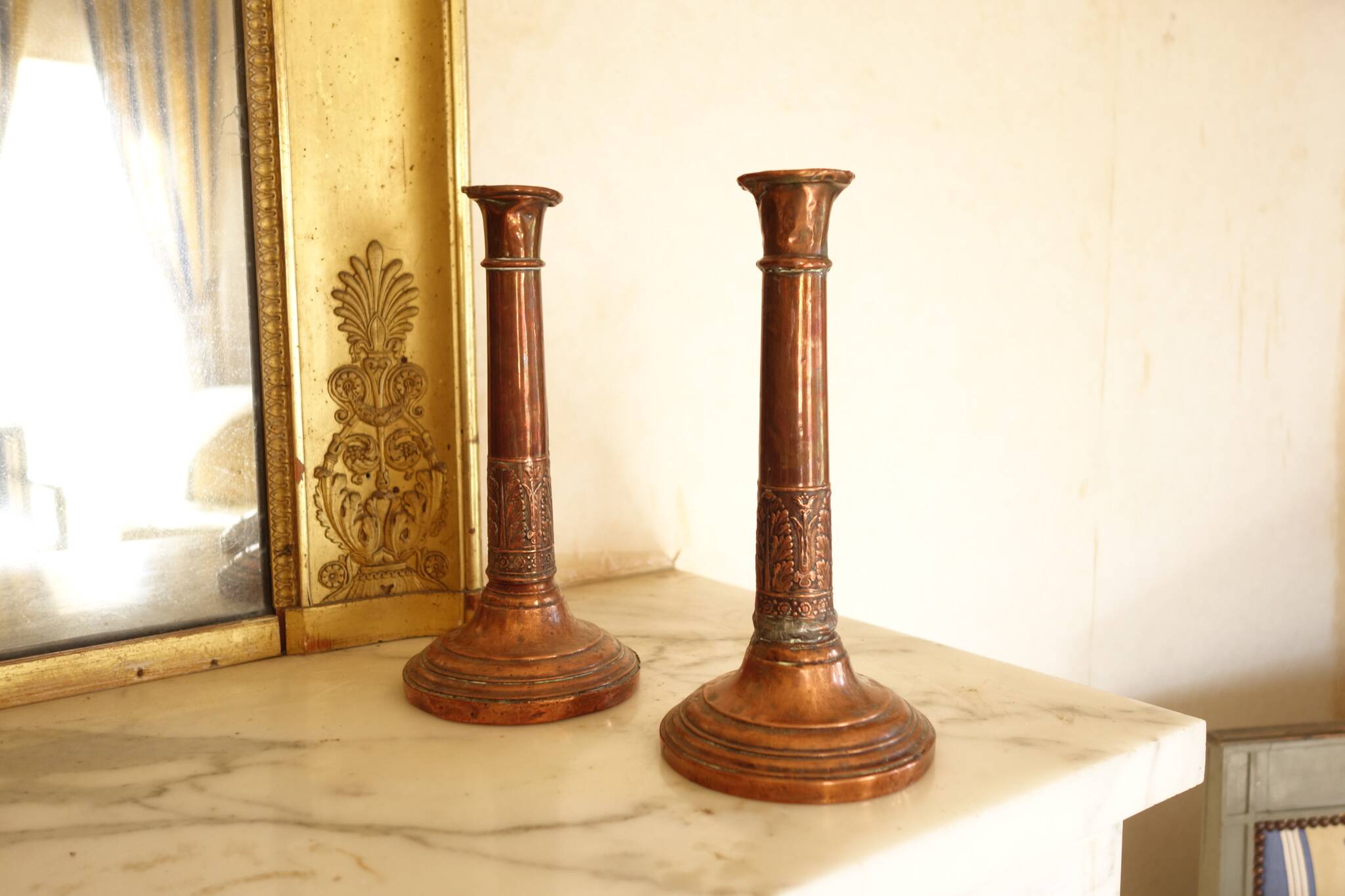 Pair of antique copper candlesticks