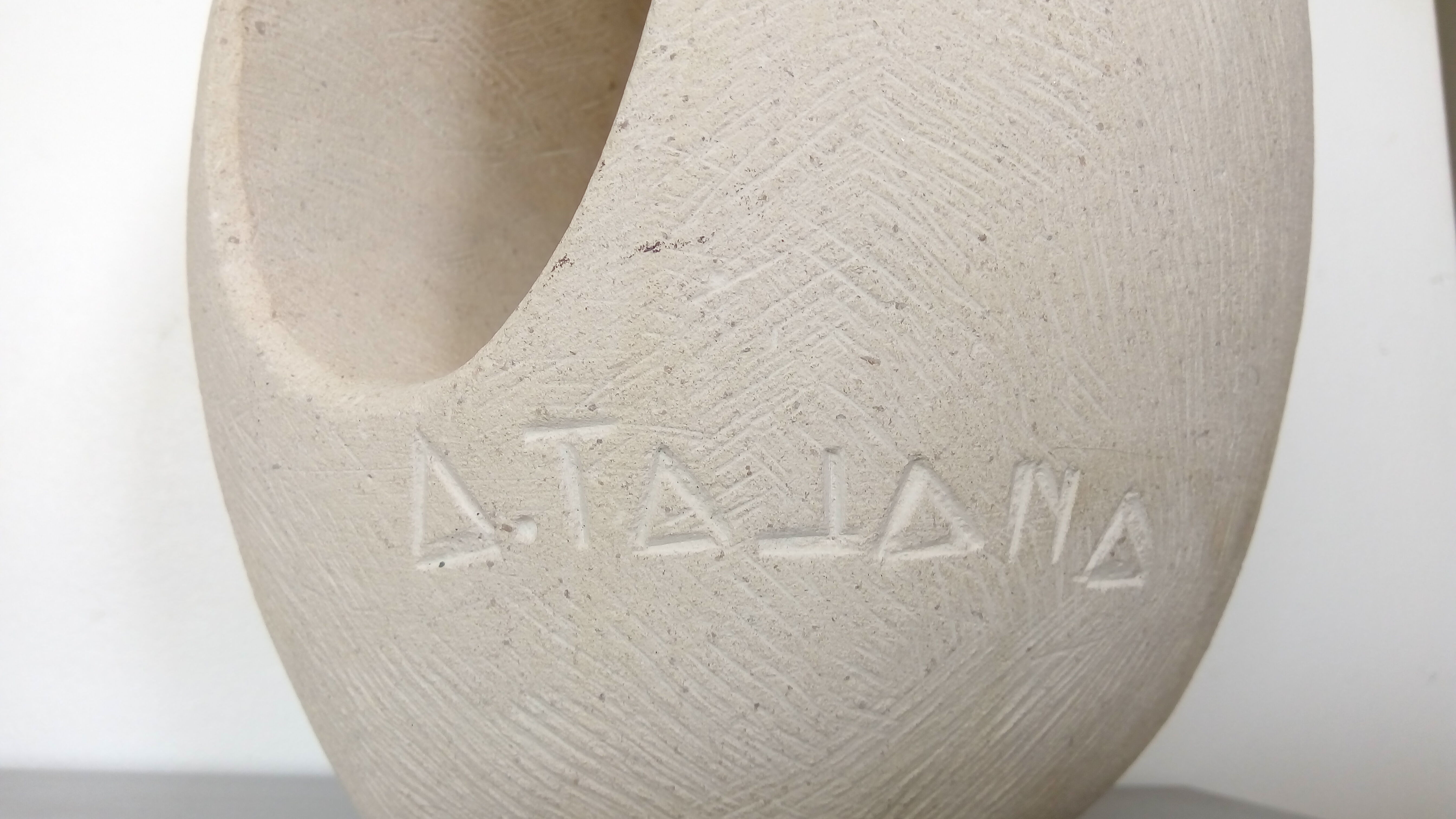 Vintage stone abstract sculpture signed Tajana