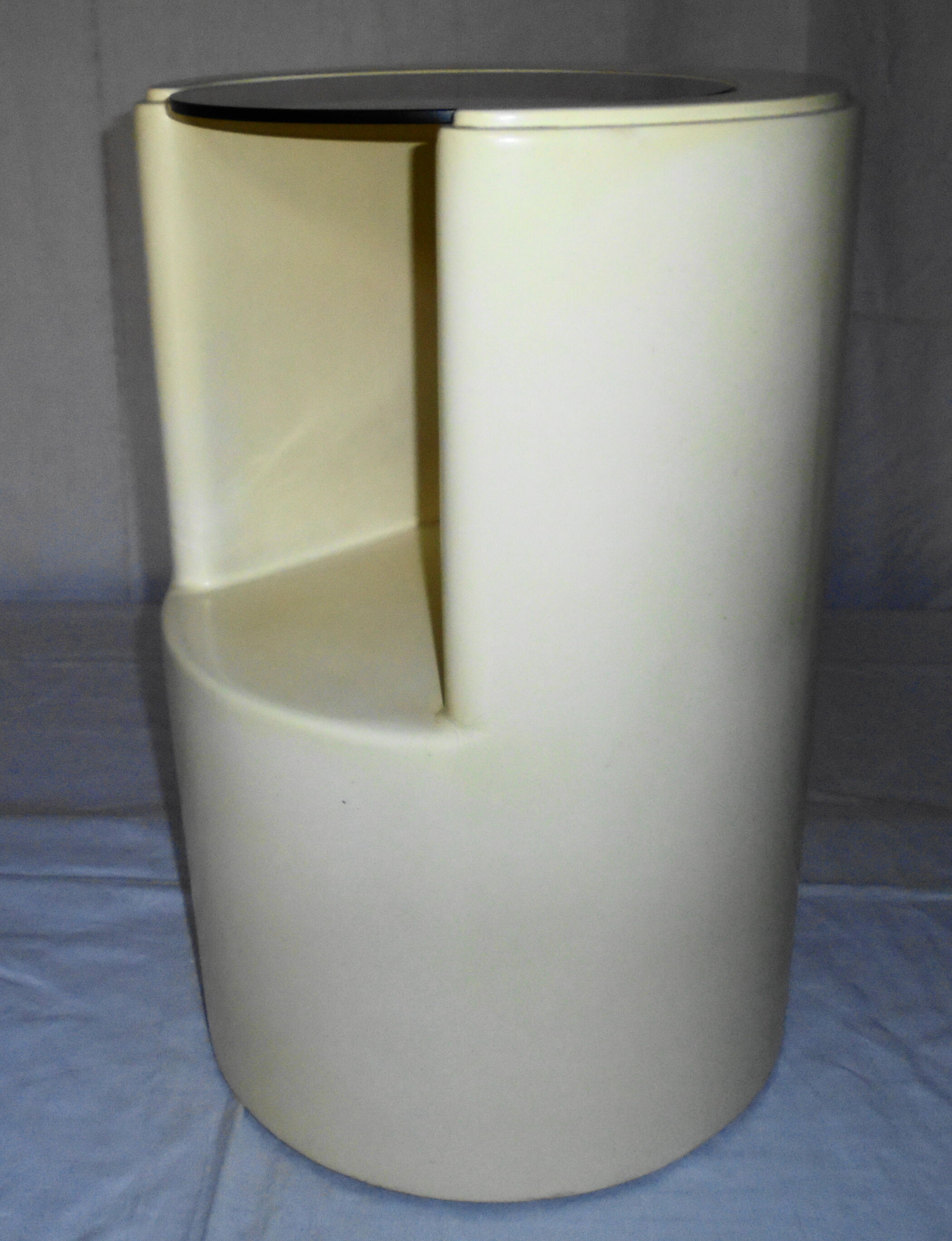 Cylindrical fiberglass bedside table from the 60s