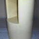 Cylindrical fiberglass bedside table from the 60s