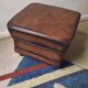 Vintage ottoman / pouffe in chestnut brown leather