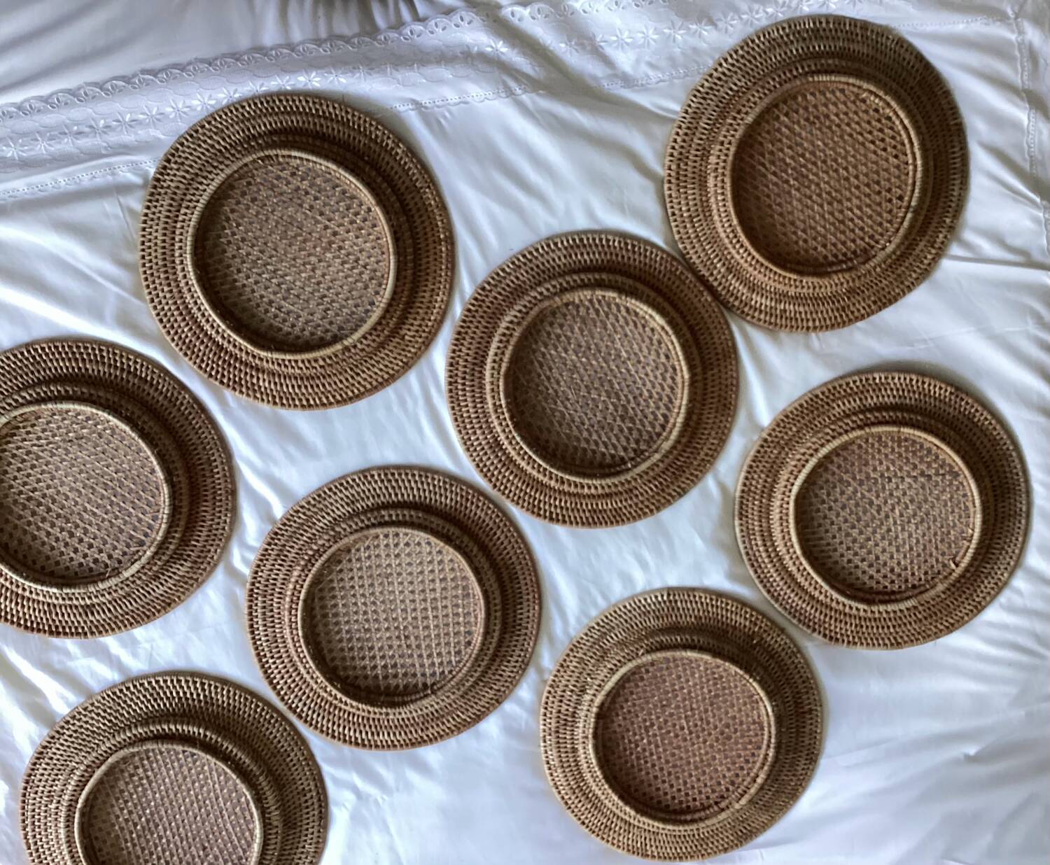 Set of round woven rattan and canework coasters