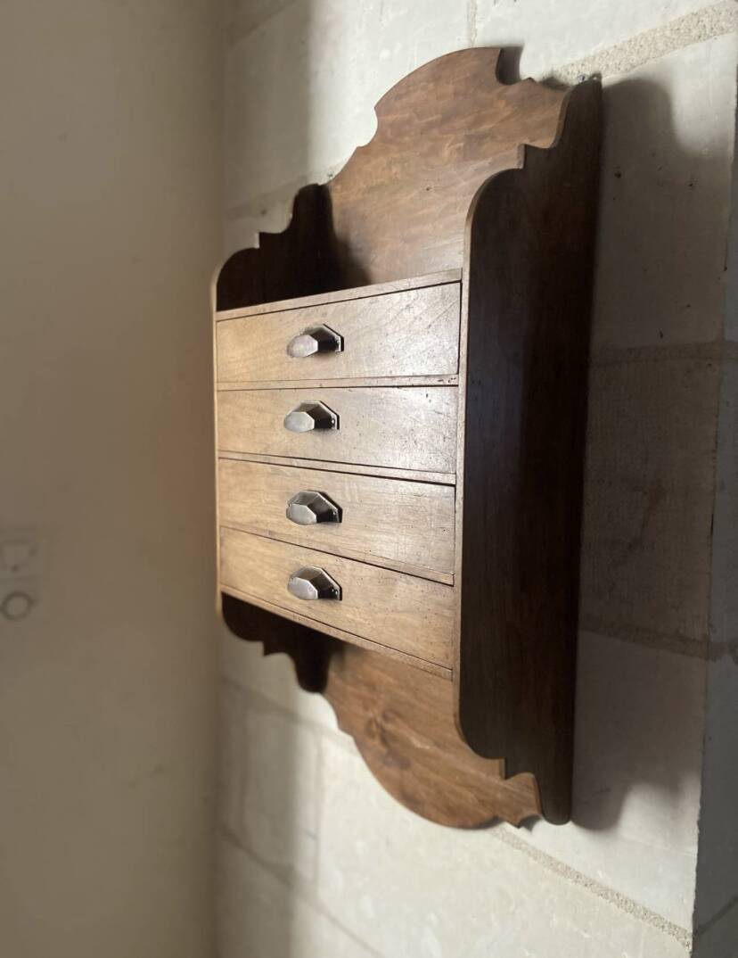 Antique piece of furniture with walnut drawers to hang