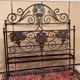Venetian bed in iron and cast iron from the Art Nouveau period with polychrome decorations