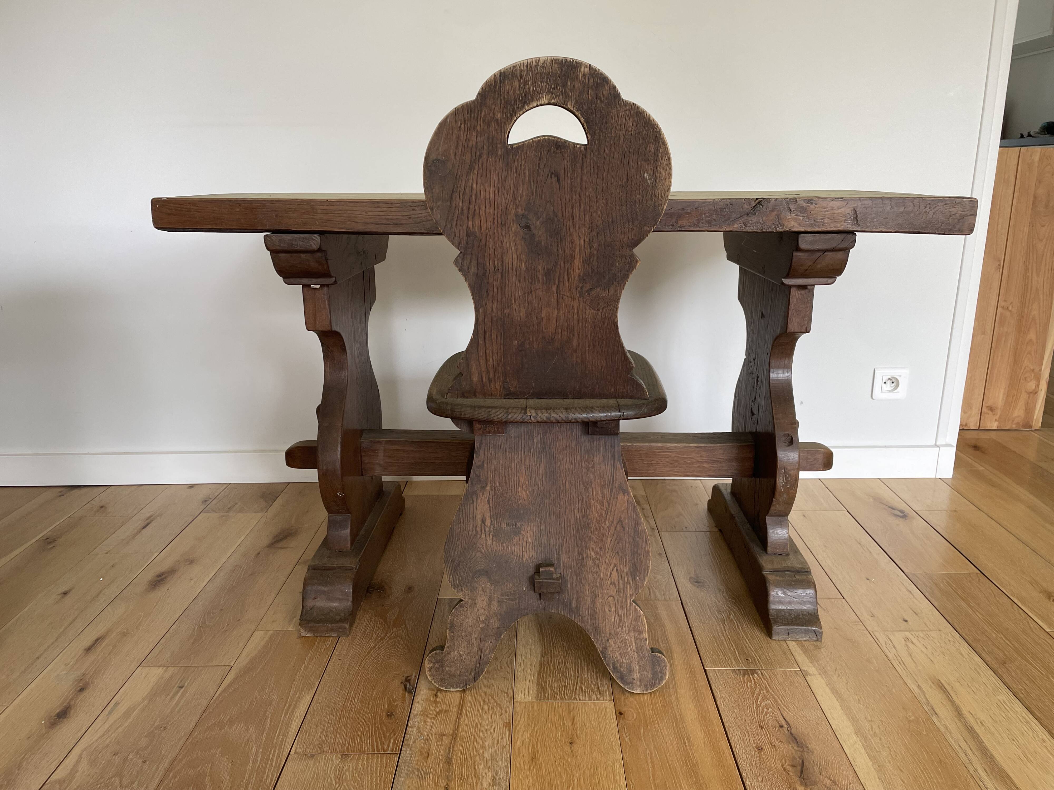 Rustic Spanish table and chair from the late 19th / early 20th century in solid oak.