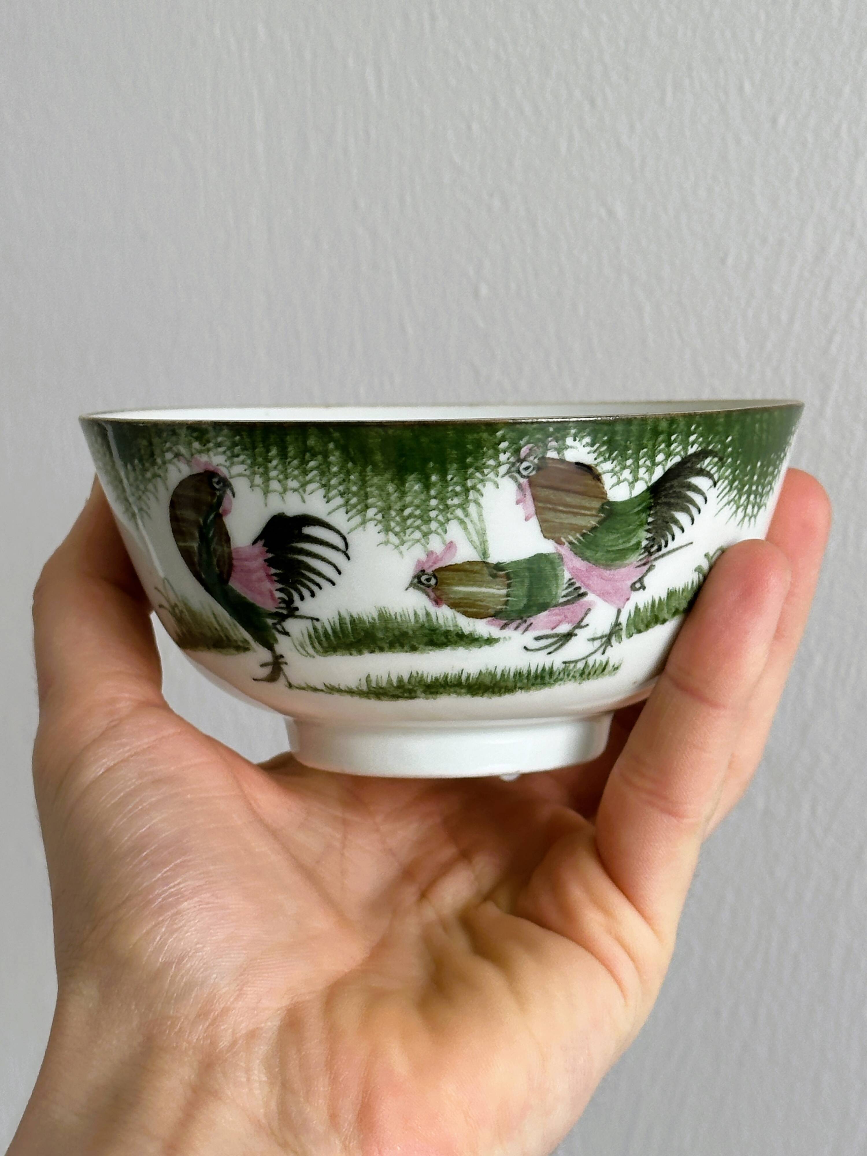 Antique porcelain bowl with rooster motif
