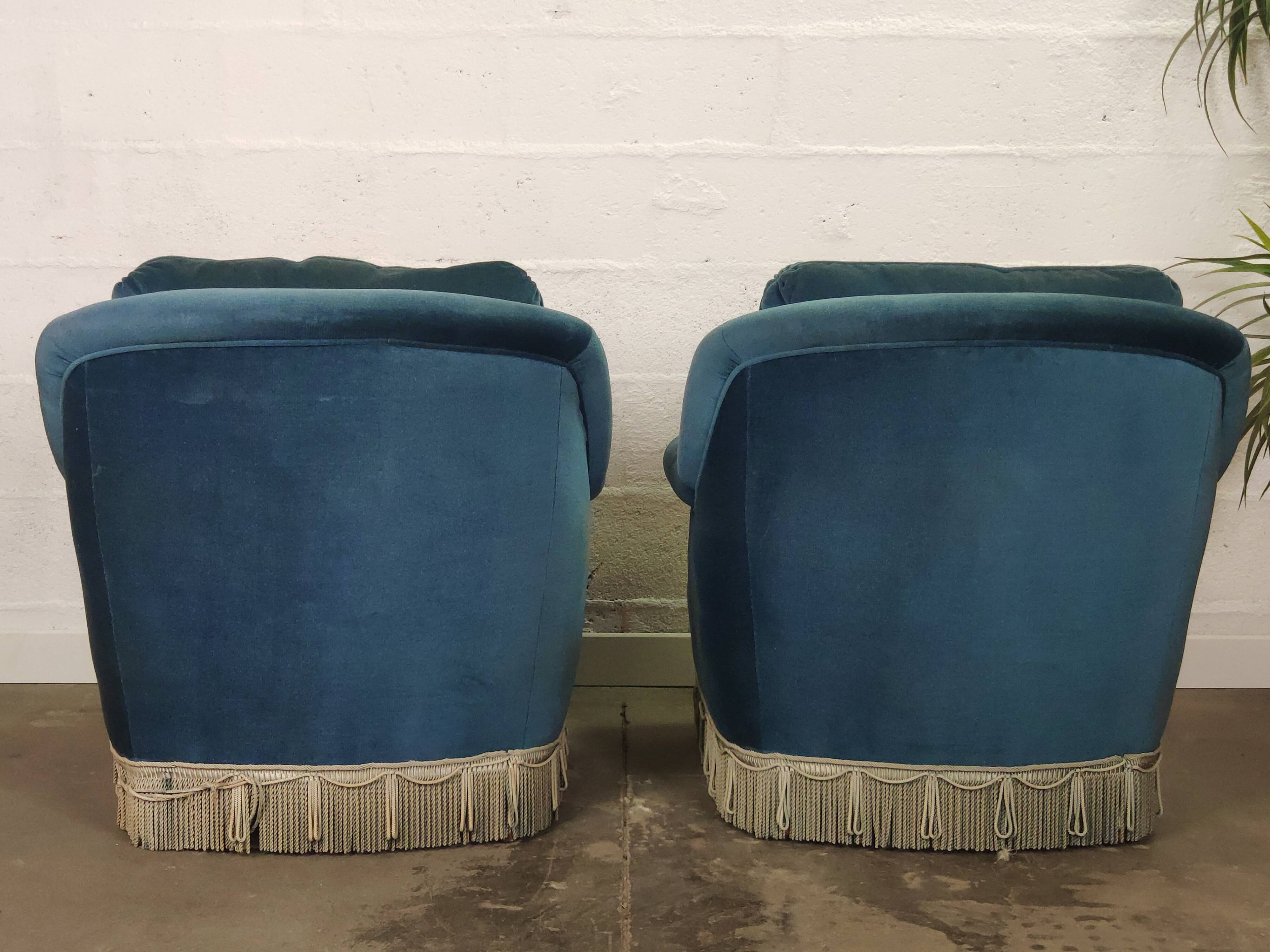 Pair of blue velvet armchairs with fringes