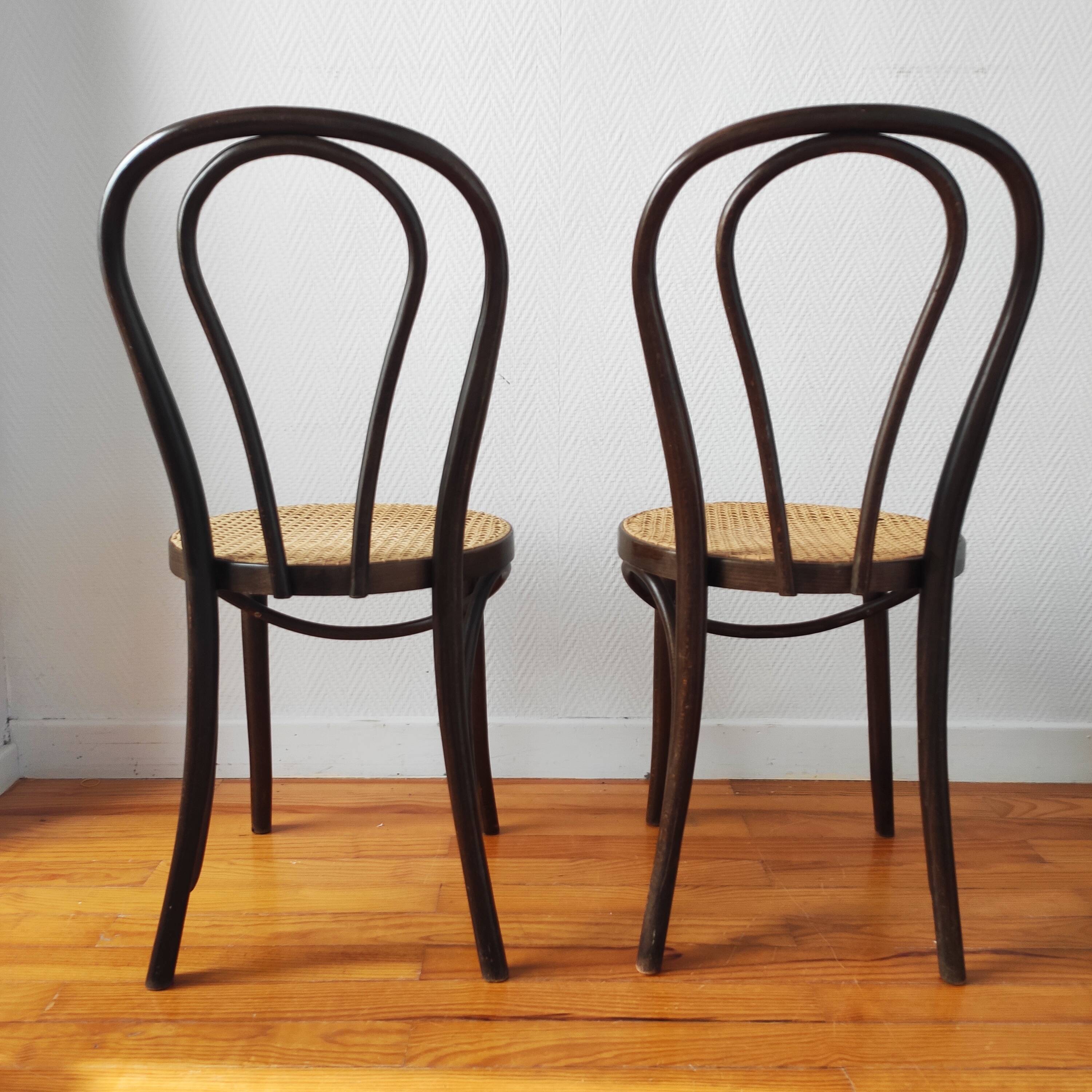 4 antique curved wood and cane chairs
