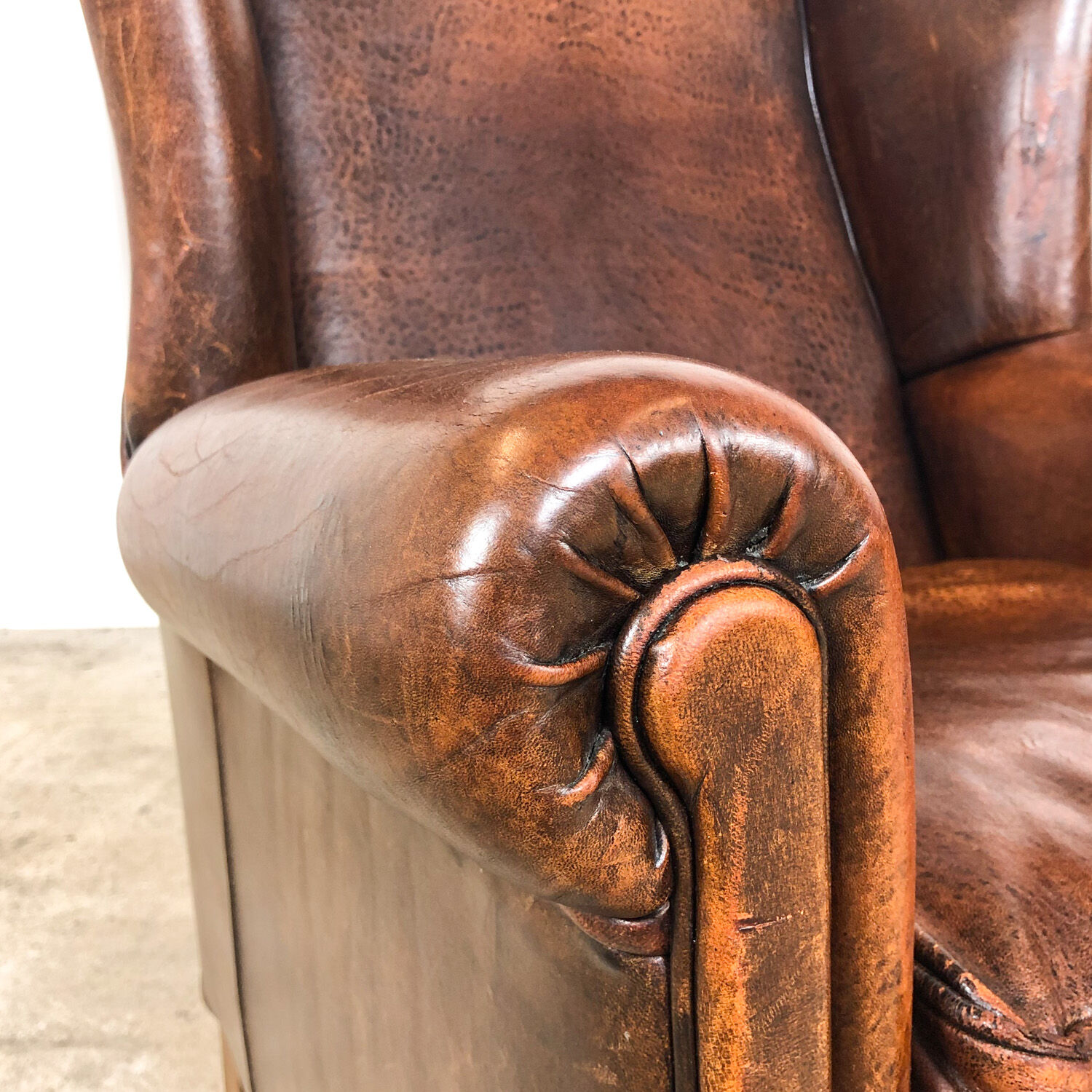 Dark brown sheep leather wingback armchair