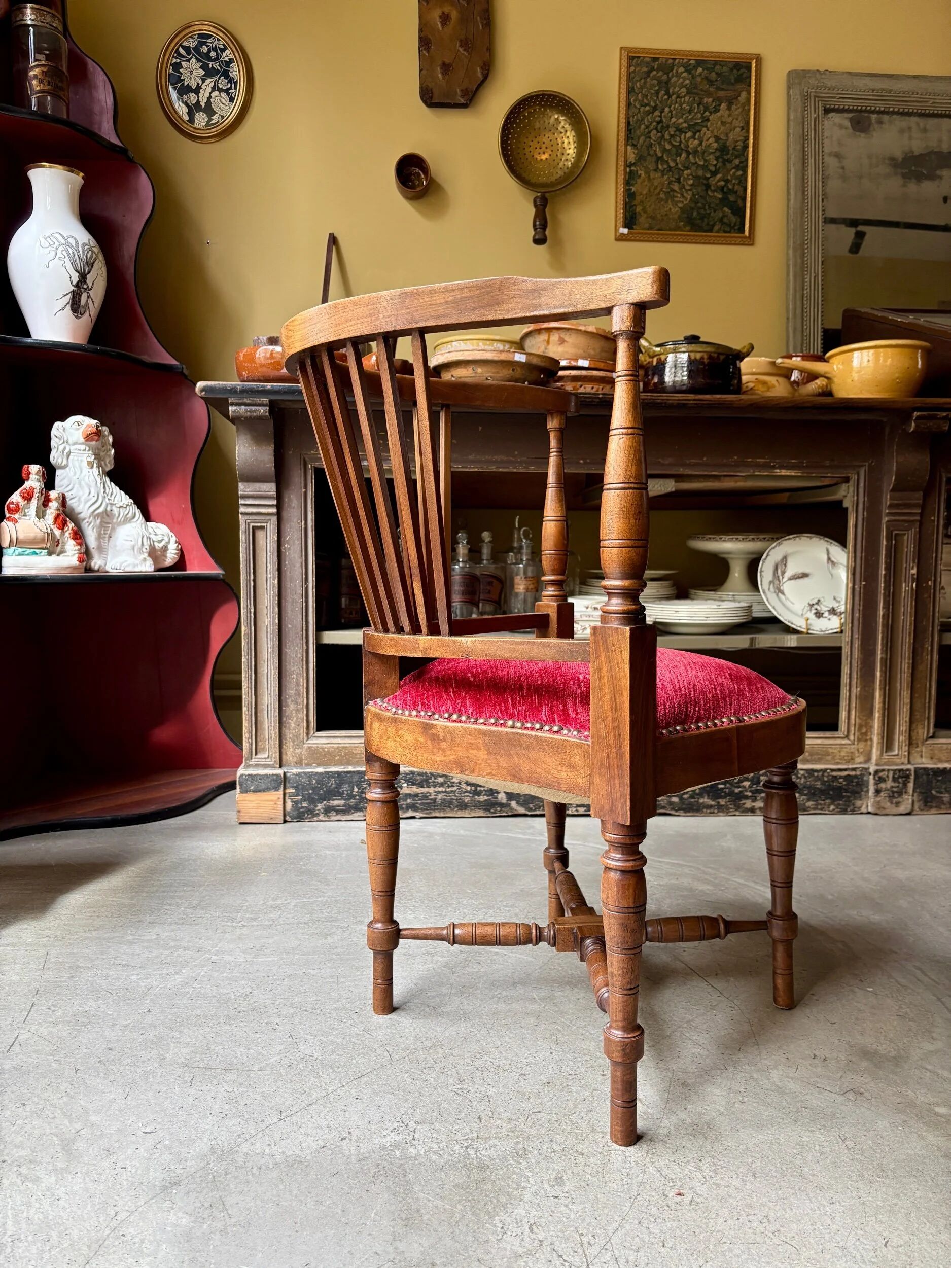 Corner armchair, dark wood and red velvet office chair.