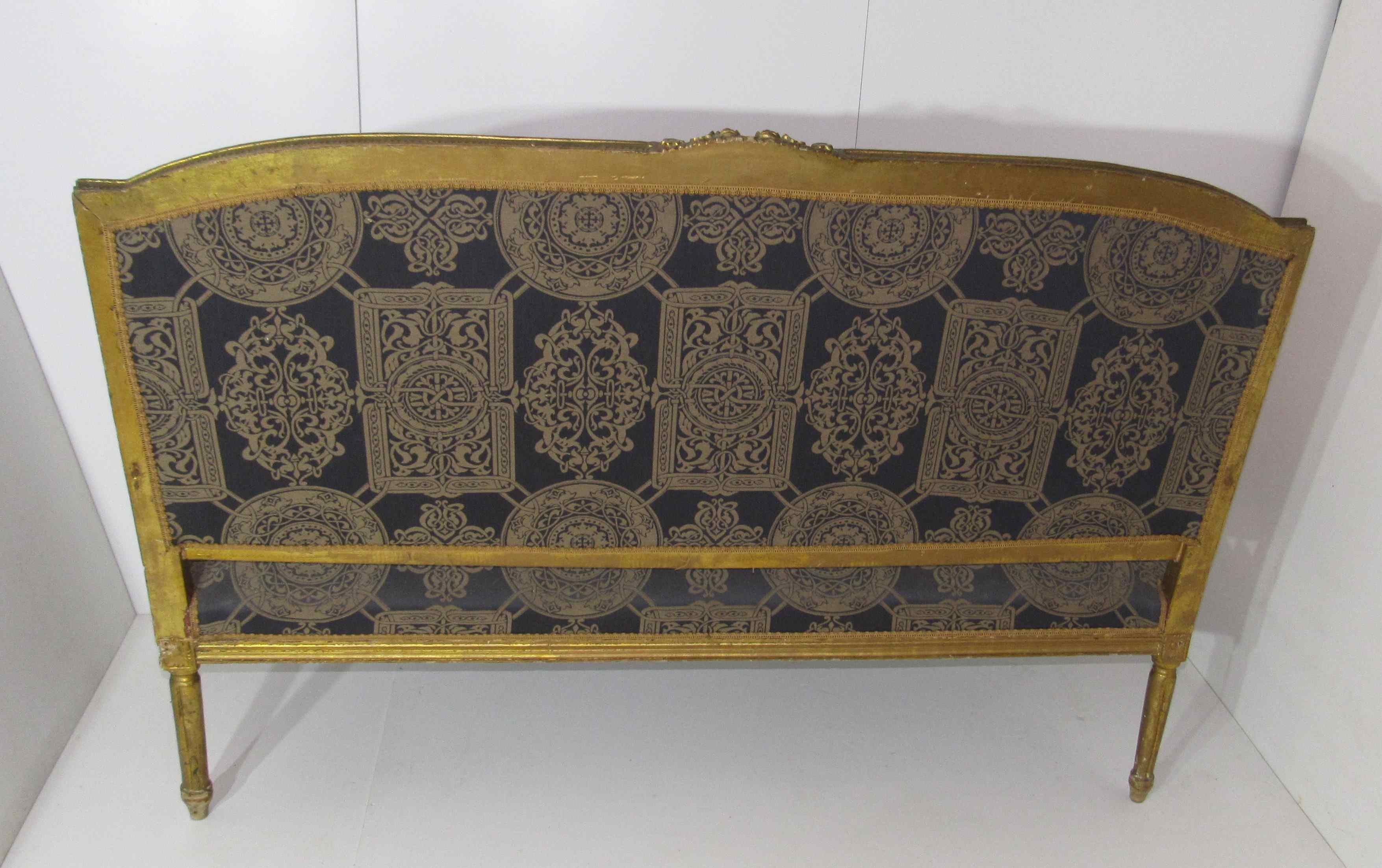 4 armchairs and a gilded wooden sofa Louis XVI style