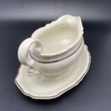 Porcelain sauce boat with black and gold checkered border