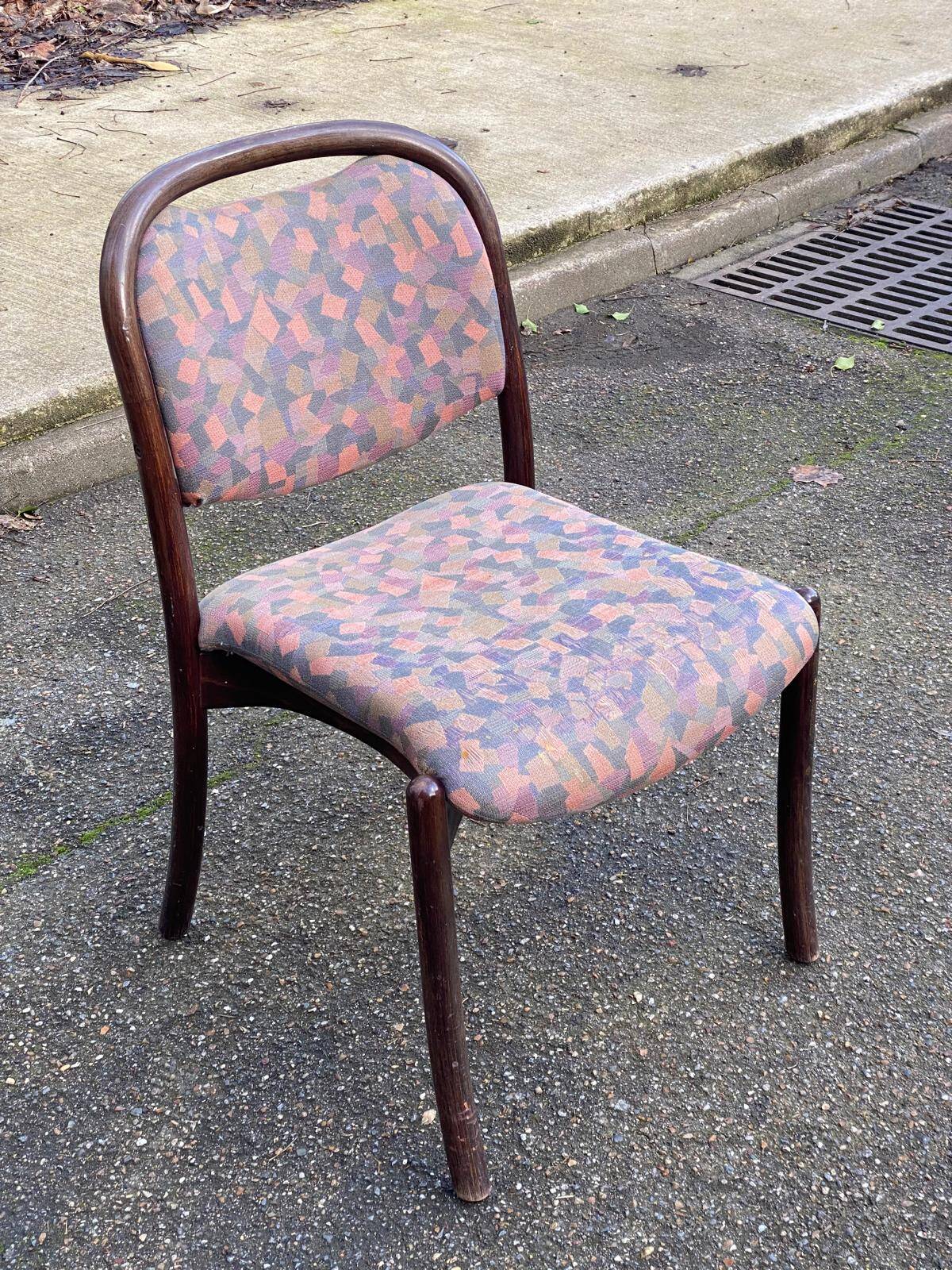 Scandinavian chair in curved solid teak wood and fabric.