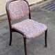 Scandinavian chair in curved solid teak wood and fabric.
