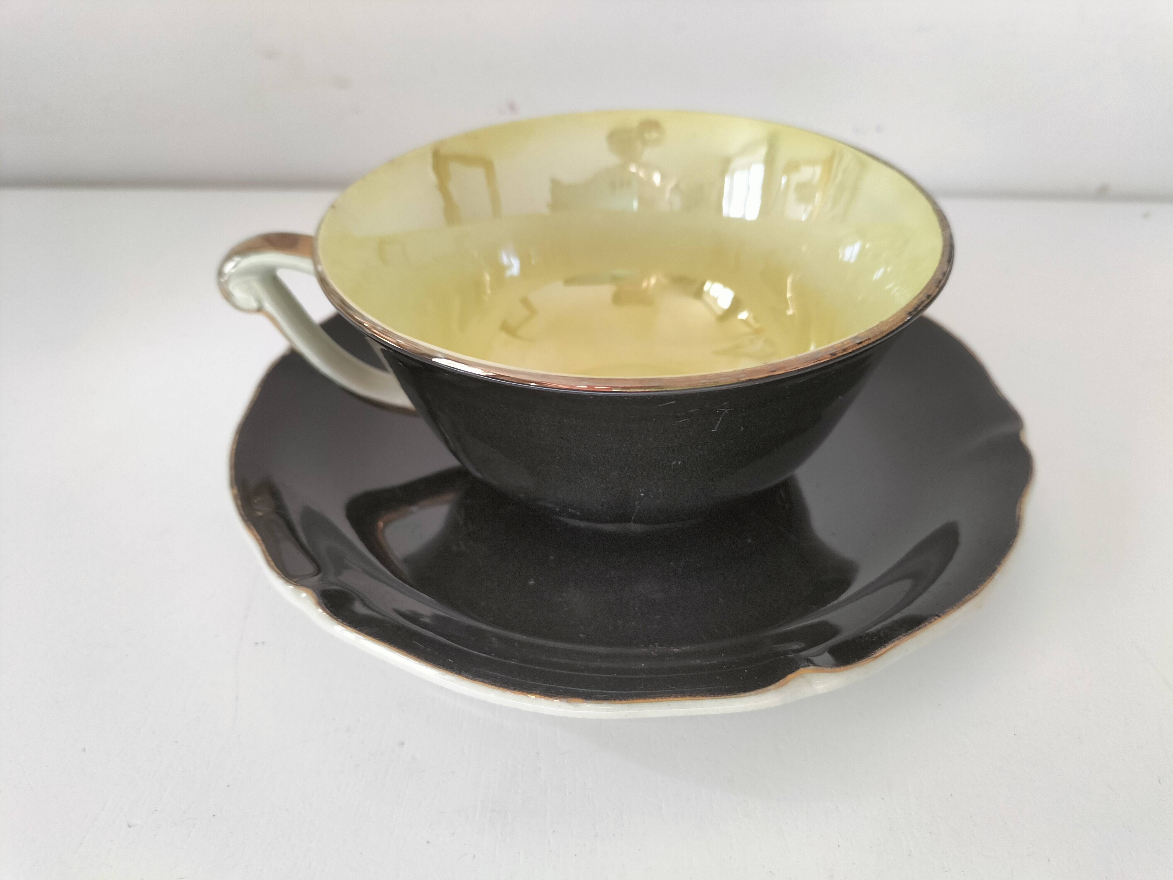Large black, yellow iridescent and white Art Deco Saint-Amand cup.