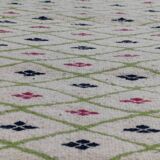 Handmade geometric patterned rug in natural wool