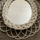 Rattan entrance set with mirror and 2 coat hooks.