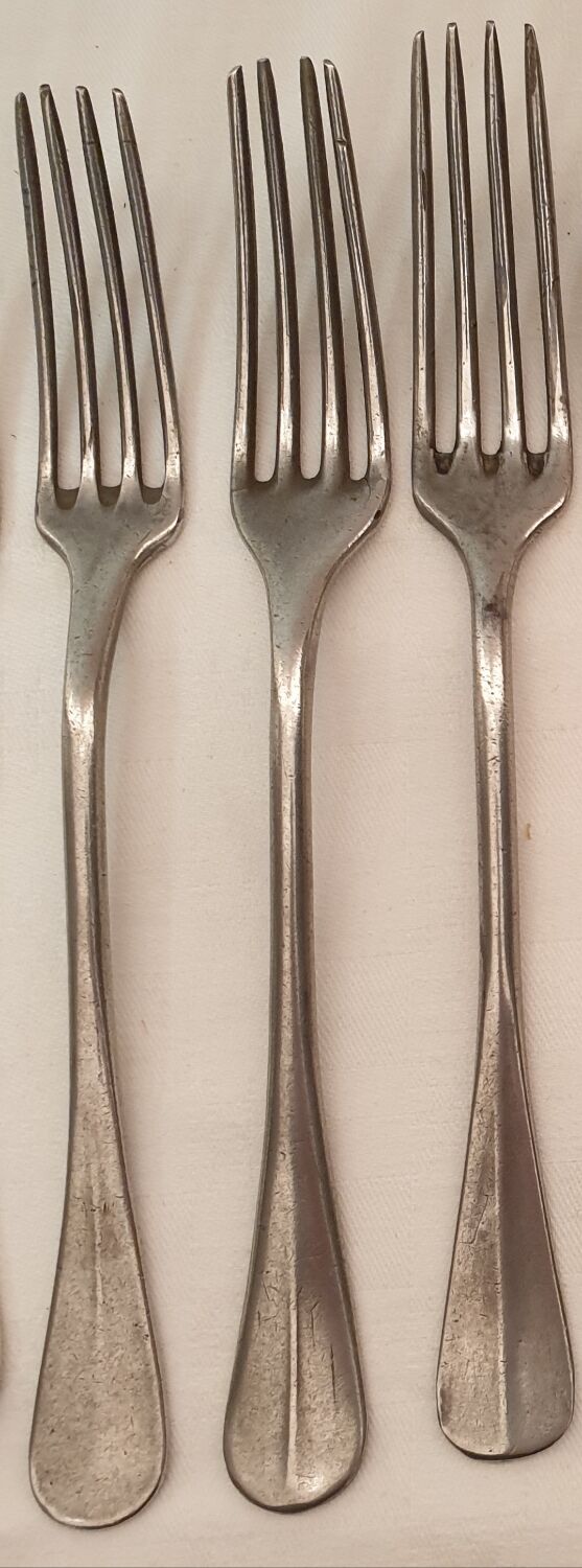 10 mismatched silver metal forks